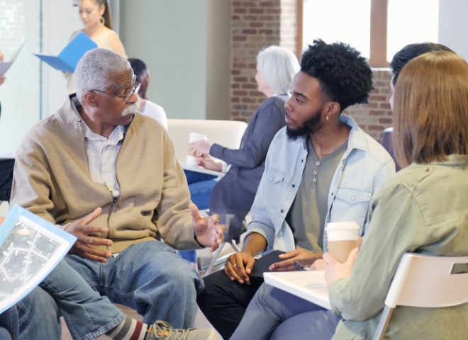 group sitting together and discussing in an indoor space